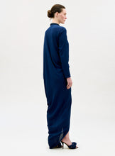 Load image into Gallery viewer, Woman wearing a long blue dress on a white background