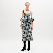 Load image into Gallery viewer, A woman wearing the Blair Skirt black and white on a white background