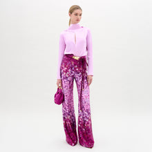 Load image into Gallery viewer, Woman wearing a pink blouse and floral pants with a white background