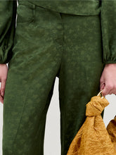 Load image into Gallery viewer, A person wearing the Emine Pant in color Hunter Green with a Sofia Bag Maxi in color Mustard on a white background.