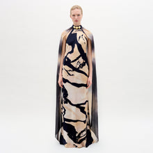 Load image into Gallery viewer, A woman wearing the Sabina Dress in color Black Beige Abstract on a white background.