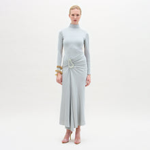 Load image into Gallery viewer, A woman wearing the Venus dress midi-dress in color Silver on a white background.