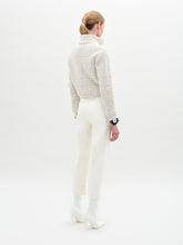 Load image into Gallery viewer, A person stands against a plain light background, wearing a textured white sweater, white collared shirt, the Moad Pant—an Italian fabric high-waisted cropped pant—and white heeled boots.