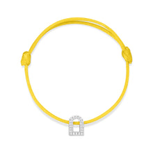 Load image into Gallery viewer, Introducing the L'Arc Voyage Charm PM, a minimalist bracelet that showcases a vibrant yellow silk cord and an elegant 18k white gold charm designed in an arch shape, adorned with sparkling Galerie diamonds. Inspired by the sophistication of a Paris Atelier, its adjustable knots offer a customizable fit for any wrist.
