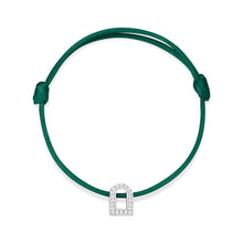 Load image into Gallery viewer, Introducing the L'Arc Voyage Charm PM bracelet, crafted in the Paris Atelier, featuring a silk cord in green adorned with an 18k white gold charm shaped like an arch and embellished with Galerie Diamonds. It is easily adjustable with its knot design.
