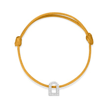 Load image into Gallery viewer, The L'Arc Voyage Charm PM bracelet elegantly showcases an arched doorway charm in 18k white gold, adorned with Galerie diamonds, set on a delicate yellow silk cord. Its minimalist design captures the essence of Paris Atelier's artistry.