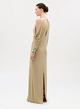 Load image into Gallery viewer, Woman wearing a beige evening gown with a high slit on a white background
