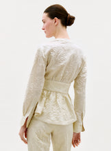 Load image into Gallery viewer, Woman wearing a cream-colored textured outfit on a white background
