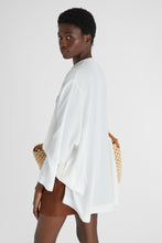 Load image into Gallery viewer, Short kaftan in pure silk crepe de chine with handmade floral appliqués
