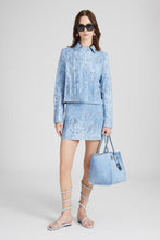 Load image into Gallery viewer, Denim miniskirt with devoré floral pattern
