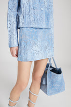 Load image into Gallery viewer, Denim miniskirt with devoré floral pattern
