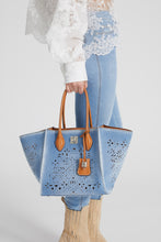 Load image into Gallery viewer, Medium Maggie in denim with handmade and hand-finished geometric cut-out
