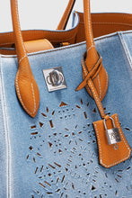 Load image into Gallery viewer, Medium Maggie in denim with handmade and hand-finished geometric cut-out
