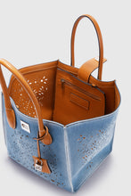 Load image into Gallery viewer, Medium Maggie in denim with handmade and hand-finished geometric cut-out
