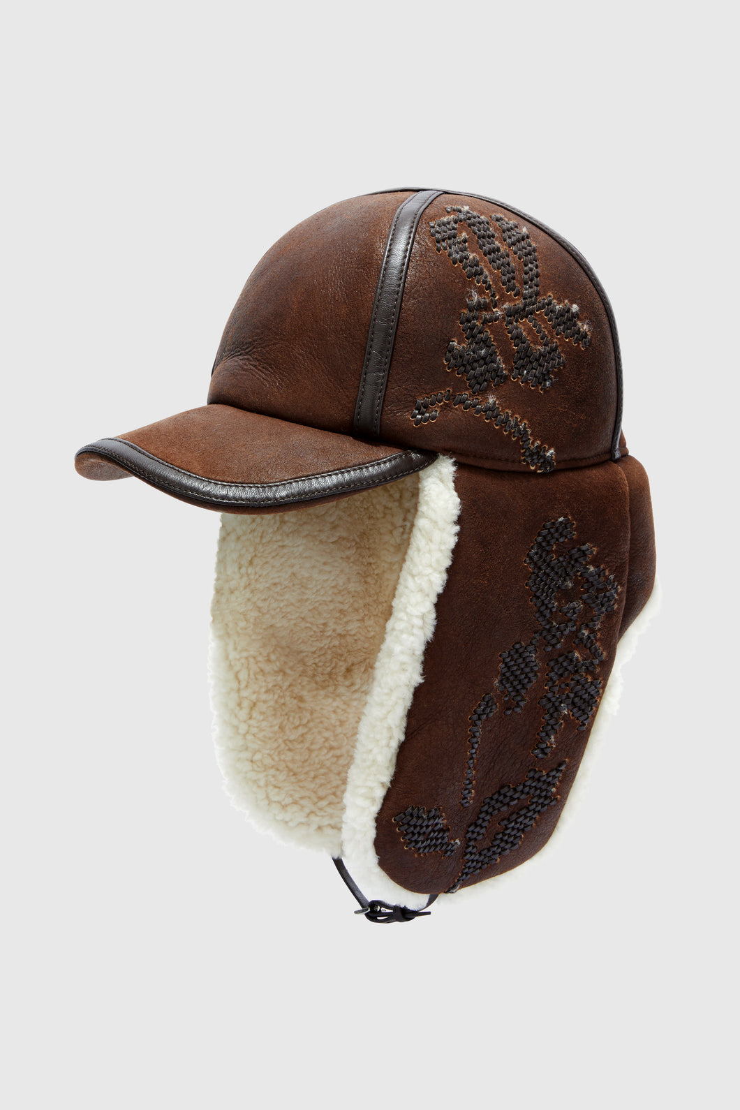 Embroidered baseball-style hat with shearling ear flaps