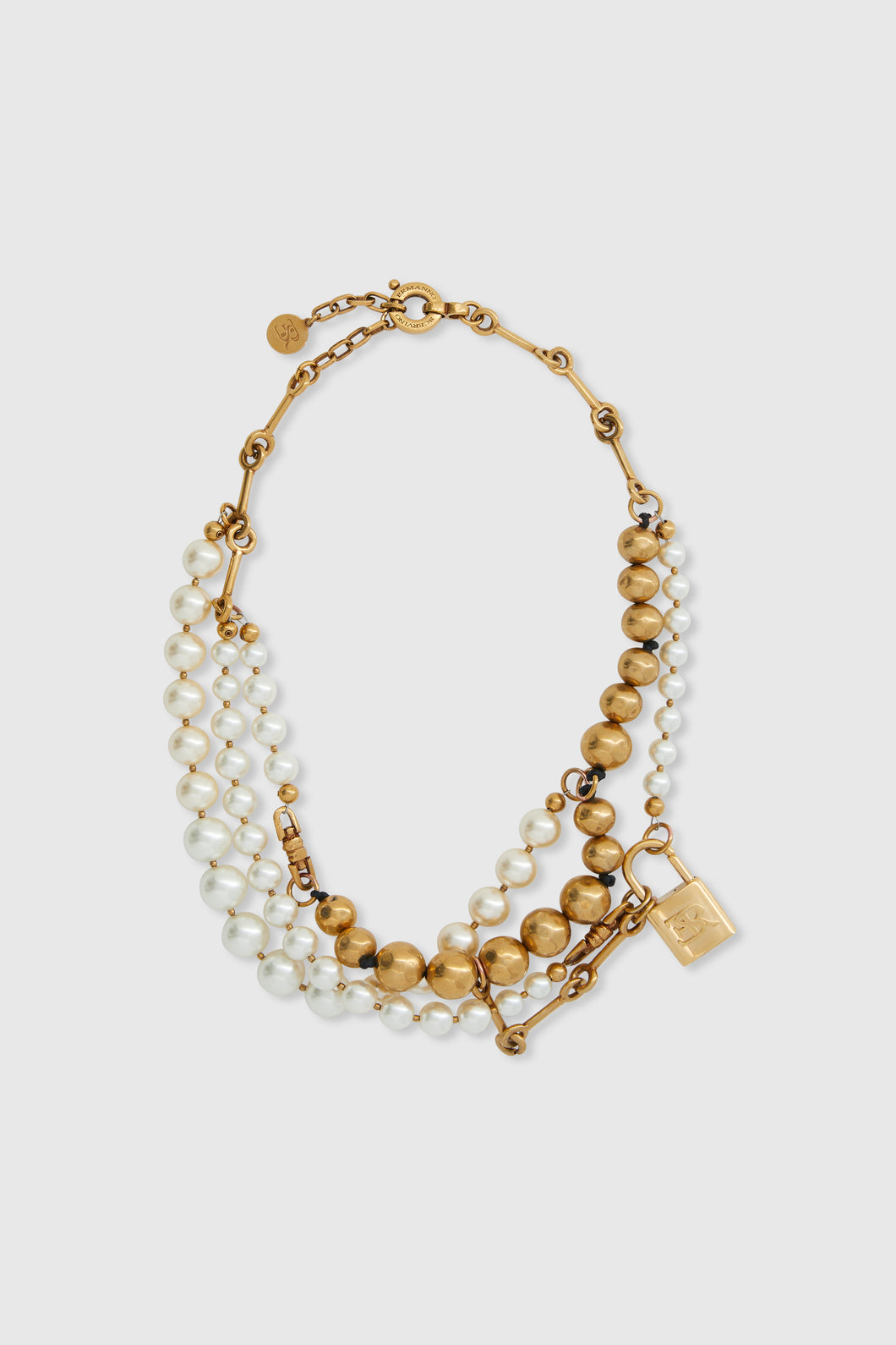 Multi-strand necklace with mix of pearls, glass, and hand-hammered metal beads – gold tone