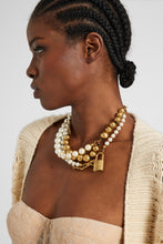 Load image into Gallery viewer, Multi-strand necklace with mix of pearls, glass, and hand-hammered metal beads – gold tone

