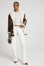Load image into Gallery viewer, Palazzo trousers in white denim with floral cut-out
