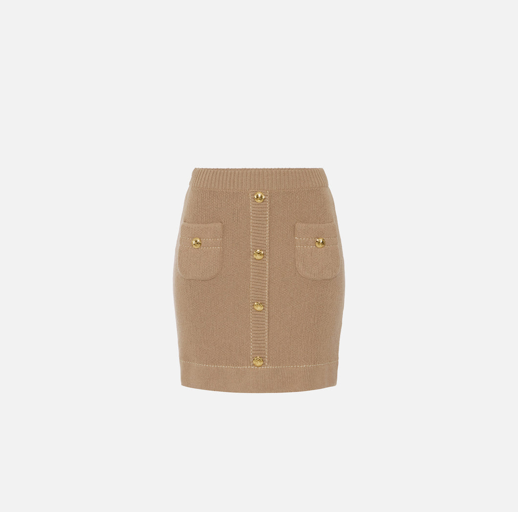Skirt in knit fabric with pockets and logoed buttons