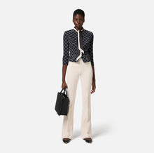 Load image into Gallery viewer, Crêpe bell-bottom trousers with logo plaque

