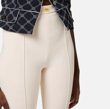 Load image into Gallery viewer, Crêpe bell-bottom trousers with logo plaque
