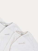 Load image into Gallery viewer, Lot of 7 White crossover bodysuits
