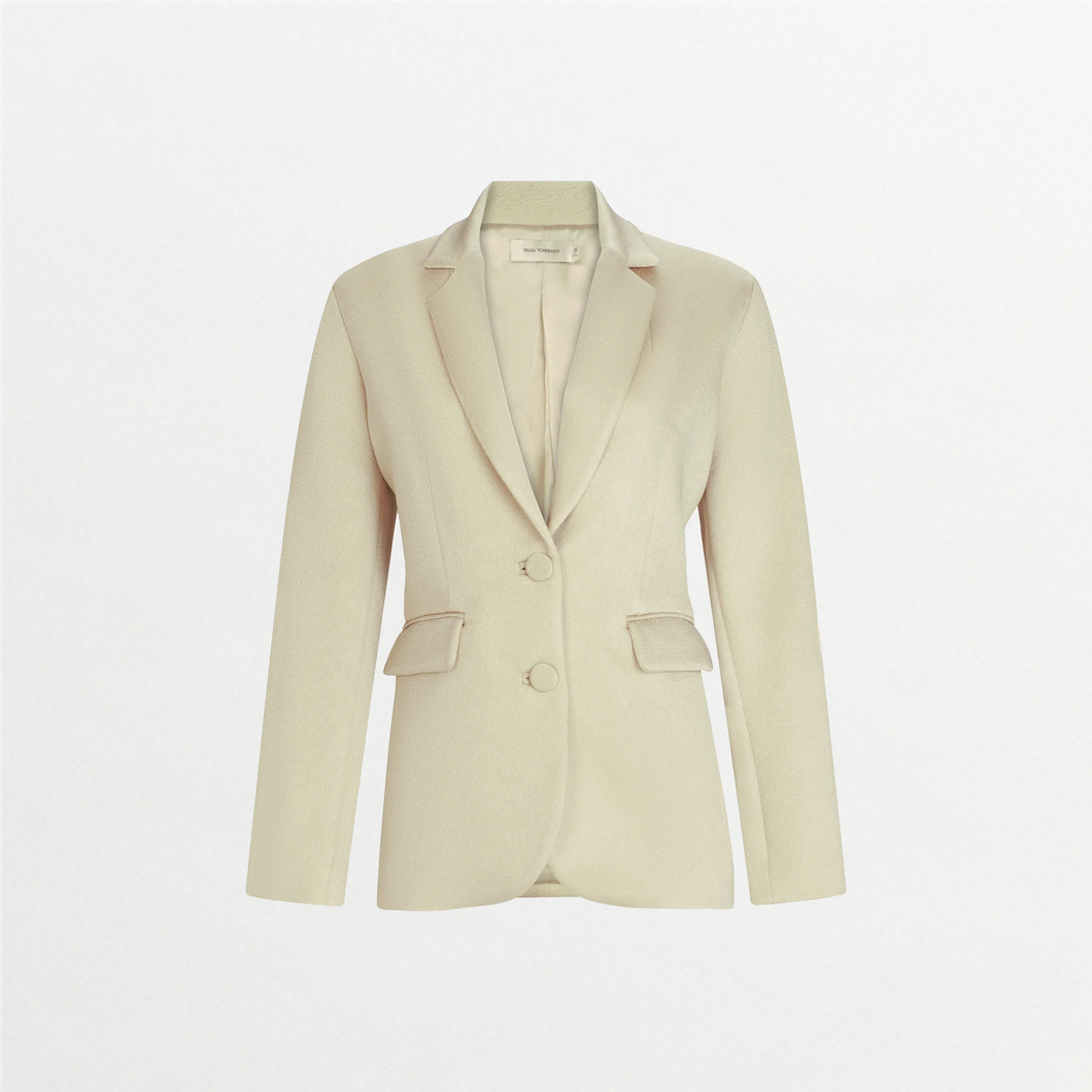 The Rebeca Jacket is a beige fitted blazer made from premium Italian fabric, featuring notched lapels, two front buttons, and two flap pockets, shown against a plain white background.