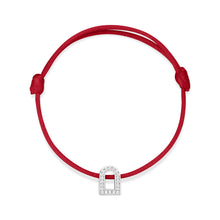 Load image into Gallery viewer, A silk cord bracelet featuring the L'Arc Voyage Charm PM in 18k white gold, embellished with Galerie diamonds and expertly tied in a simple knot, showcasing the craftsmanship of a Paris Atelier.
