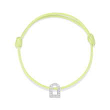 Load image into Gallery viewer, Introducing the L'Arc Voyage Charm PM bracelet from our Paris Atelier collection, featuring an 18k white gold arch-shaped charm adorned with Galerie diamonds. This exquisite piece is beautifully paired with an adjustable light green silk cord.

