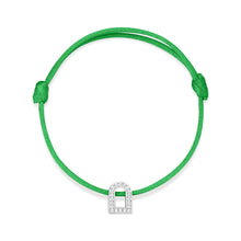 Load image into Gallery viewer, The L'Arc Voyage Charm PM bracelet showcases an 18k white gold arch-shaped charm adorned with Galerie diamonds, beautifully set on a green silk cord with an adjustable knot design.
