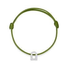 Load image into Gallery viewer, The L'Arc Voyage Charm PM bracelet, crafted from 18k white gold and adorned with Galerie diamonds, is set on a silk cord in green with an adjustable knot design. Reminiscent of a Paris Atelier creation, this elegant piece is showcased against a plain white background.
