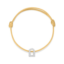 Load image into Gallery viewer, A L'Arc Voyage Charm PM, crafted from 18k white gold and adorned with Galerie diamonds, elegantly rests on a delicate yellow silk cord bracelet with an adjustable knot.
