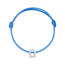 Load image into Gallery viewer, A silk cord bracelet featuring the L'Arc Voyage Charm PM in 18k white gold, embellished with Galerie diamonds, and designed with adjustable knots for a perfect fit.
