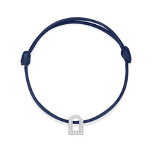 Load image into Gallery viewer, Introducing the L'Arc Voyage Charm PM by Paris Atelier, a minimalist bracelet featuring an adjustable navy silk cord and a petite 18k white gold padlock charm adorned with Galerie diamonds.
