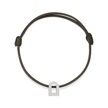 Load image into Gallery viewer, A silk cord bracelet featuring the L'Arc Voyage Charm PM, crafted from 18k white gold and embellished with Galerie Diamonds. This subtly curved charm, echoing a Paris Atelier design, is symmetrically suspended at the center of the bracelet.
