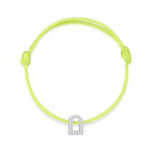 Load image into Gallery viewer, The L'Arc Voyage Charm PM bracelet, featuring an adjustable neon green silk cord and a small arch-shaped charm crafted in 18k white gold adorned with Galerie diamonds, is beautifully presented against a pristine white background. This exquisite piece is from the Paris Atelier collection.
