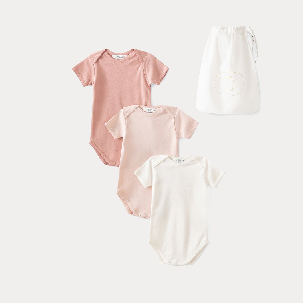 set of three baby organic cotton onesies pale pink